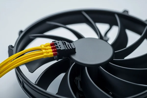 A 3-pin fan with its yellow tachometer wire clearly visible