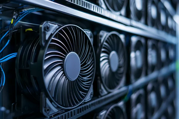 A close-up of a server rack with multiple fans visible