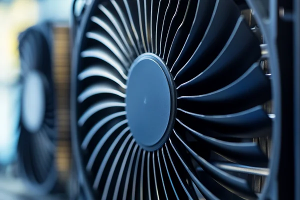 A fan pulling air through a thin radiator