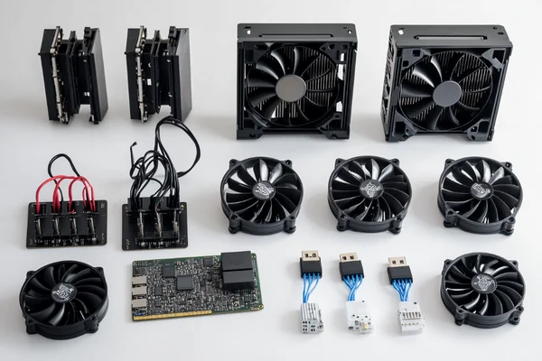 An assortment of devices that use 5V fans, like a 3D printer and a network switch