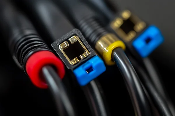 Close-up photograph of a 4-wire DC fan connector showing PWM and tachometer signal pins alongside power connections