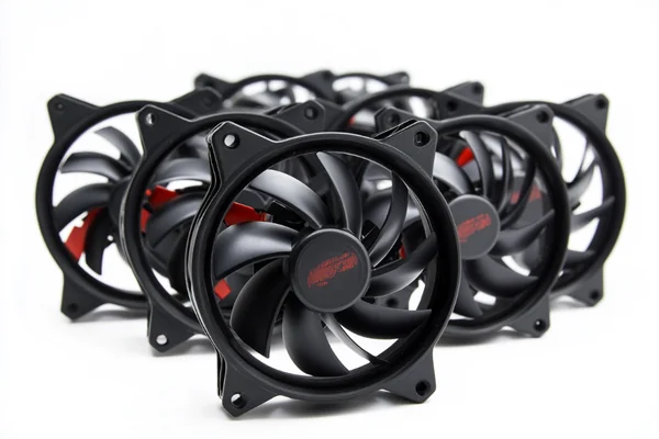 A collection of DC axial fans in various sizes, showing the blades and frame.