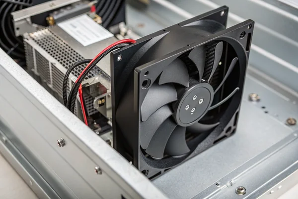 A DC axial fan mounted in a battery management system enclosure for thermal monitoring