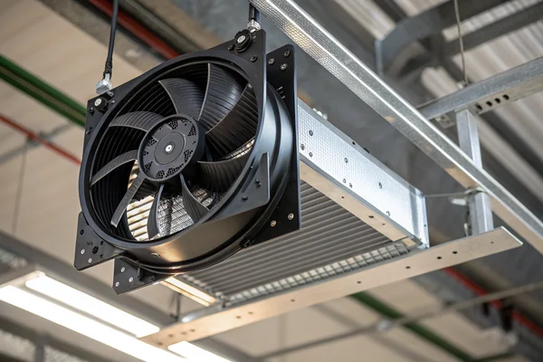 A DC axial fan mounted on an aluminum heat sink inside a high-bay LED fixture