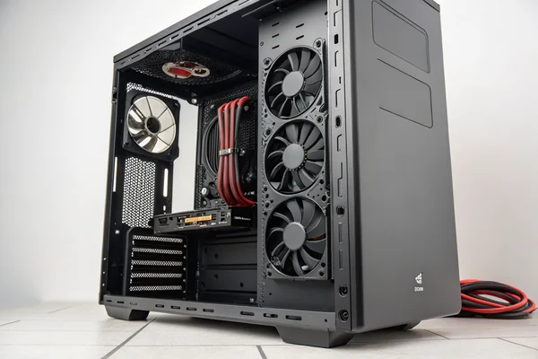 A high-airflow PC build with a 360mm radiator mounted at the top of a full-tower case, three fans visible on the radiator surface, and two additional intake fans at the front panel