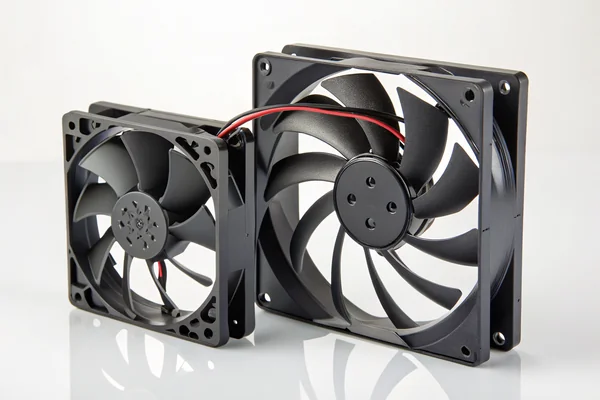 A slim 10mm-deep DC axial fan compared side by side with a standard 25mm-deep fan of the same diameter