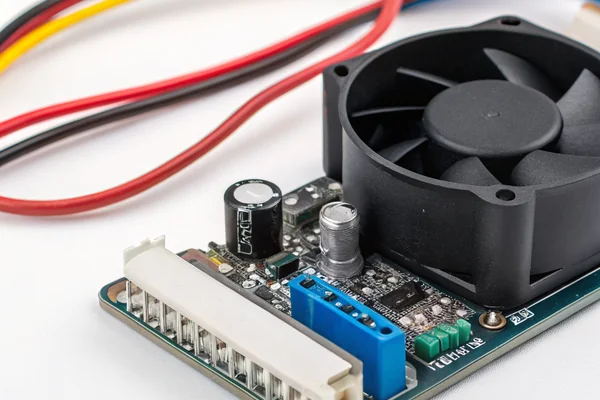 A standalone PWM fan speed controller module wired to a DC axial fan