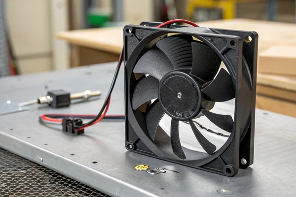 A vibration-tested DC axial fan mounted for automotive electronics cooling application
