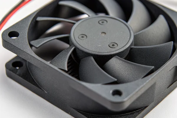 Close-up of a small continuous-duty DC axial fan inside a smart home hub