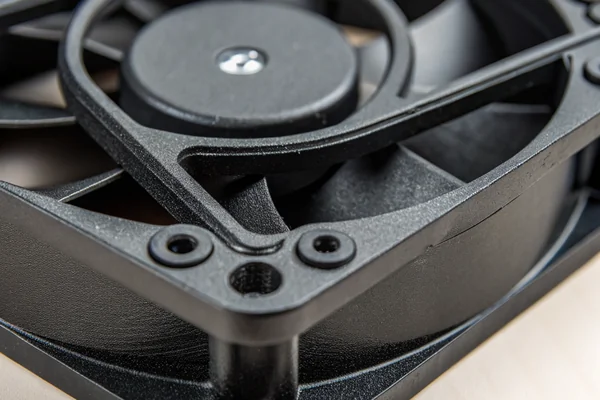 Rubber anti-vibration grommet mounts installed on a 80mm DC axial fan being fitted into an aluminum amplifier rear panel