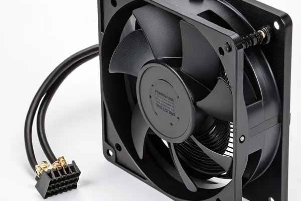 Close-up of a DC axial fan mounted on an electronics enclosure panel with visible mounting hardware and cable routing